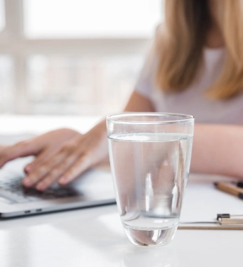 Woman with water in a glass